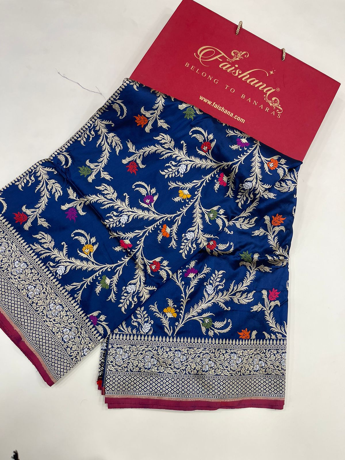 Symphony of Elegance and Tradition: Faishana Pure Handloom Navy Blue Katan Silk Multicolor Minakari Kadhwa Jaal and Zari Border with Navy Stripe Blouse