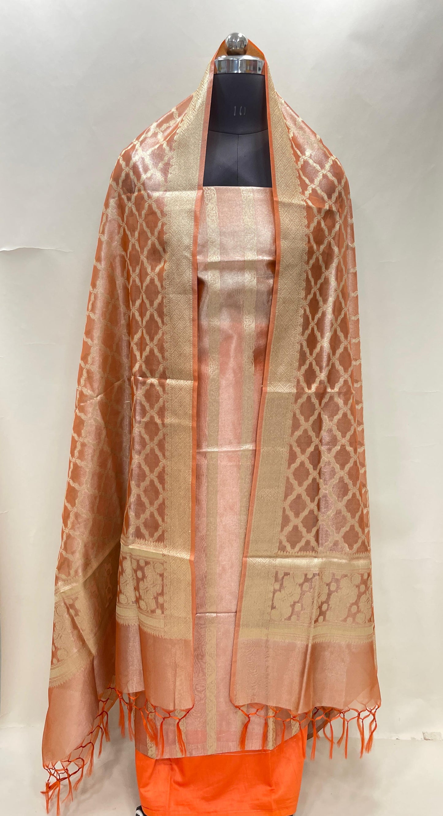Orange tissue silk suit set with floral zari stripe and carry dupatta. SHL_75