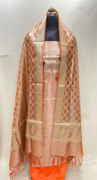 Orange tissue silk suit set with floral zari stripe and carry dupatta. SHL_75