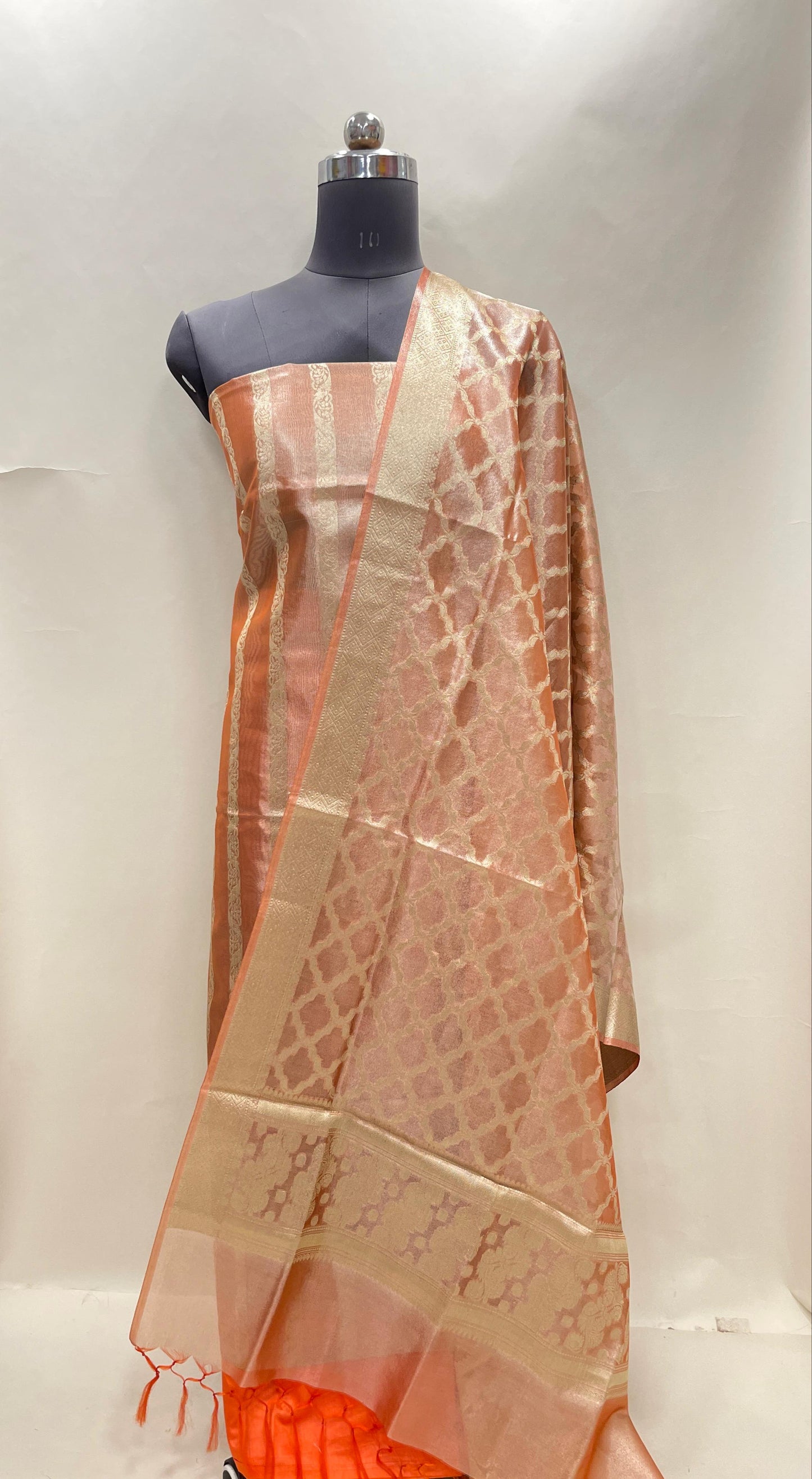 Orange tissue silk suit set with floral zari stripe and carry dupatta. SHL_75