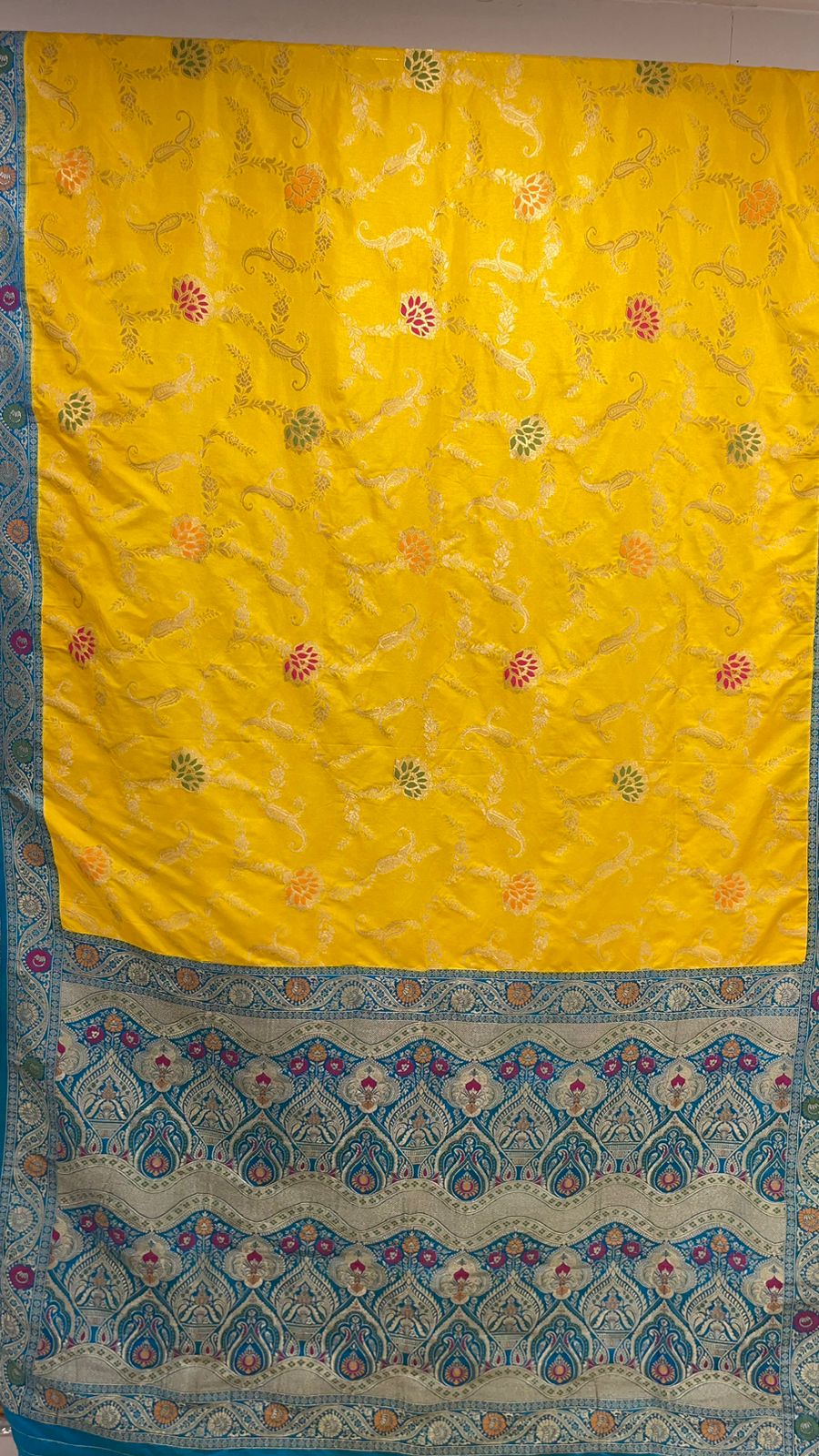 Faishana Presents Yellow Dupion Silk Floral Mina Zari Jaal with Contrast Sky Blue Paithani Mina Zari Pallu Zari Border and Sky Blue Blouse