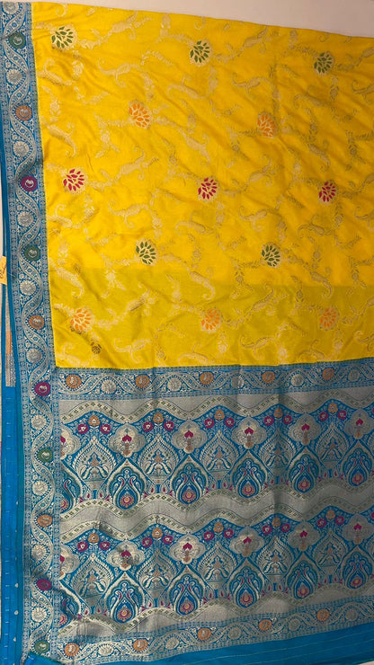 Faishana Presents Yellow Dupion Silk Floral Mina Zari Jaal with Contrast Sky Blue Paithani Mina Zari Pallu Zari Border and Sky Blue Blouse