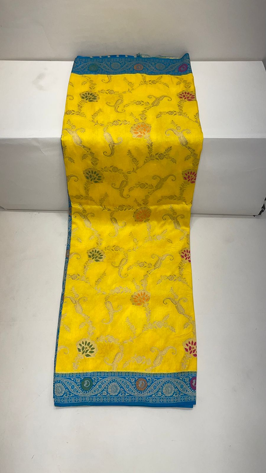 Faishana Presents Yellow Dupion Silk Floral Mina Zari Jaal with Contrast Sky Blue Paithani Mina Zari Pallu Zari Border and Sky Blue Blouse