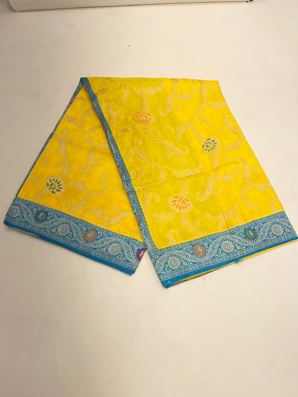 Faishana Presents Yellow Dupion Silk Floral Mina Zari Jaal with Contrast Sky Blue Paithani Mina Zari Pallu Zari Border and Sky Blue Blouse