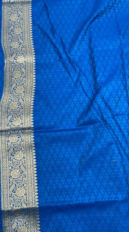 Faishana Presents Off-white Katan Silk Floral Light Gold Zari Booti with Contrast Blue Floral Pallu Banarasi saree and Blue Blouse