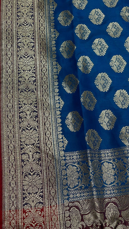 Faishana Presents Blue Satin Silk Silver Zari Floral Boota and Contrast Red Zari Border and Heavy Silver Zari Floral Anchal Banarasi Saree with Red Blouse