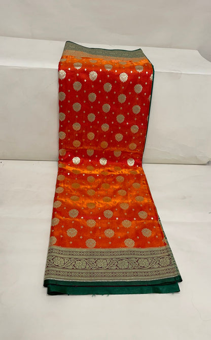 Faishana Presents Orange Satin Silk Zari Booti and Contrast Green 2D Zari Border and Heavy Floral Jaal Pallu Banarasi Saree with Green Blouse