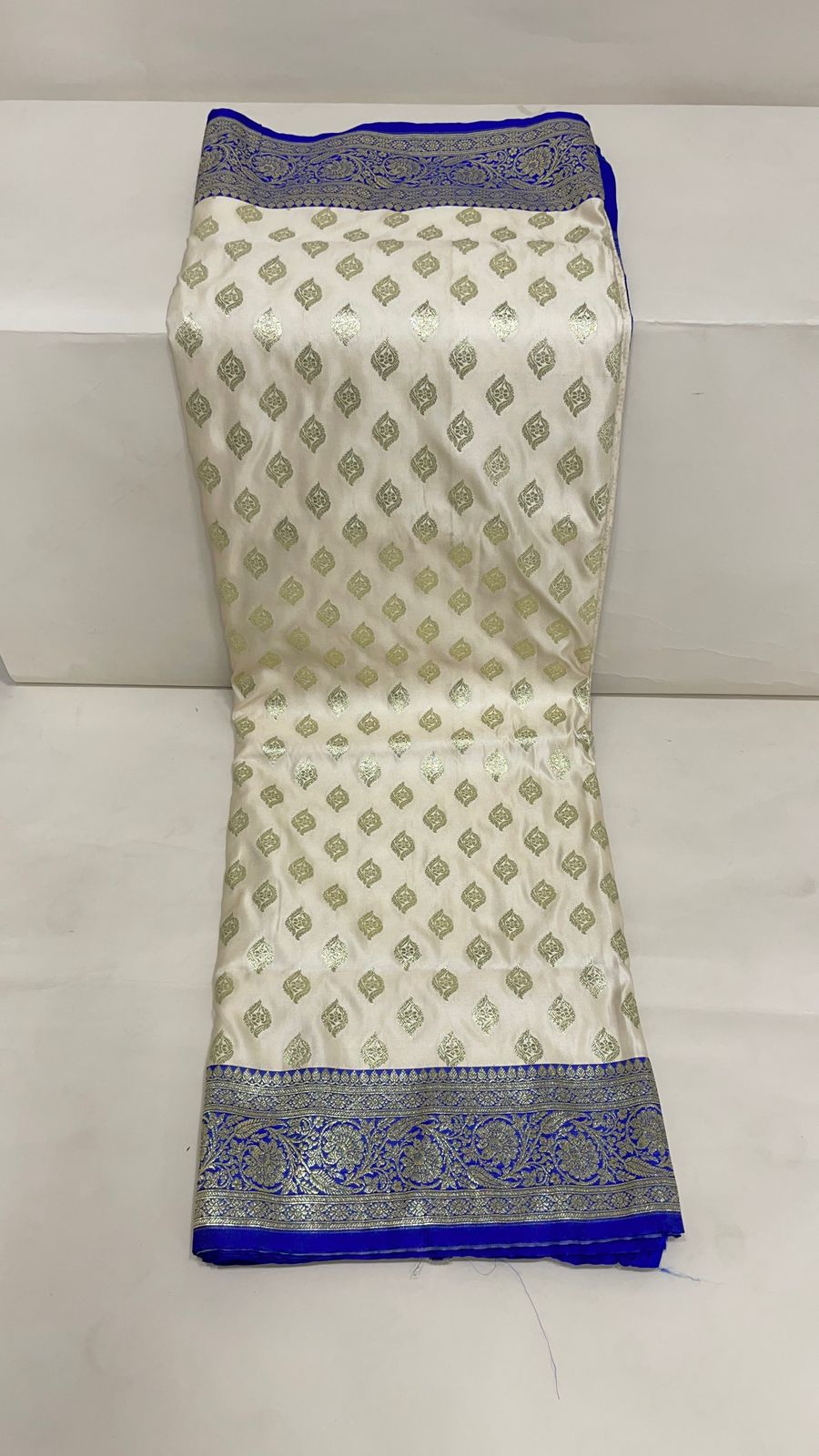 Faishana Presents Off-White Katan Silk Floral Light Gold Zari Booti with Contrast Blue Floral Pallu Banarasi saree and Blue Blouse
