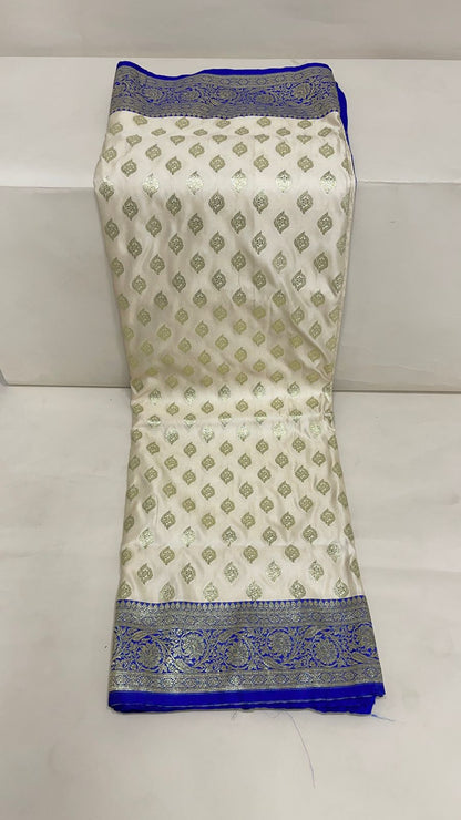 Faishana Presents Off-White Katan Silk Floral Light Gold Zari Booti with Contrast Blue Floral Pallu Banarasi saree and Blue Blouse
