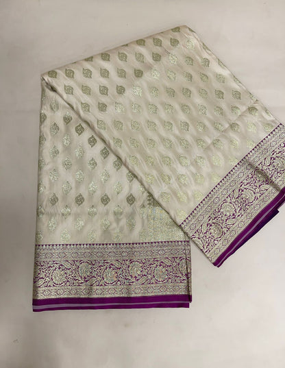 Faishana Presents Off-White Katan Silk Floral Light Gold Zari Booti with Contrast Purple Floral Pallu Banarasi saree and Purple Blouse