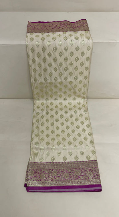 Faishana Presents Off-White Katan Silk Floral Light Gold Zari Booti with Contrast Purple Floral Pallu Banarasi saree and Purple Blouse
