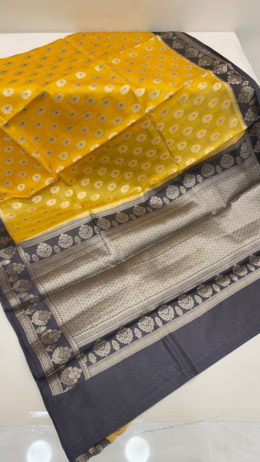 Faishana Pure Handwoven Yellow Tussar Silk Floral Mina Zari Booti with Contrast Black Mina Floral Zari Border and Pallu with Black Blouse