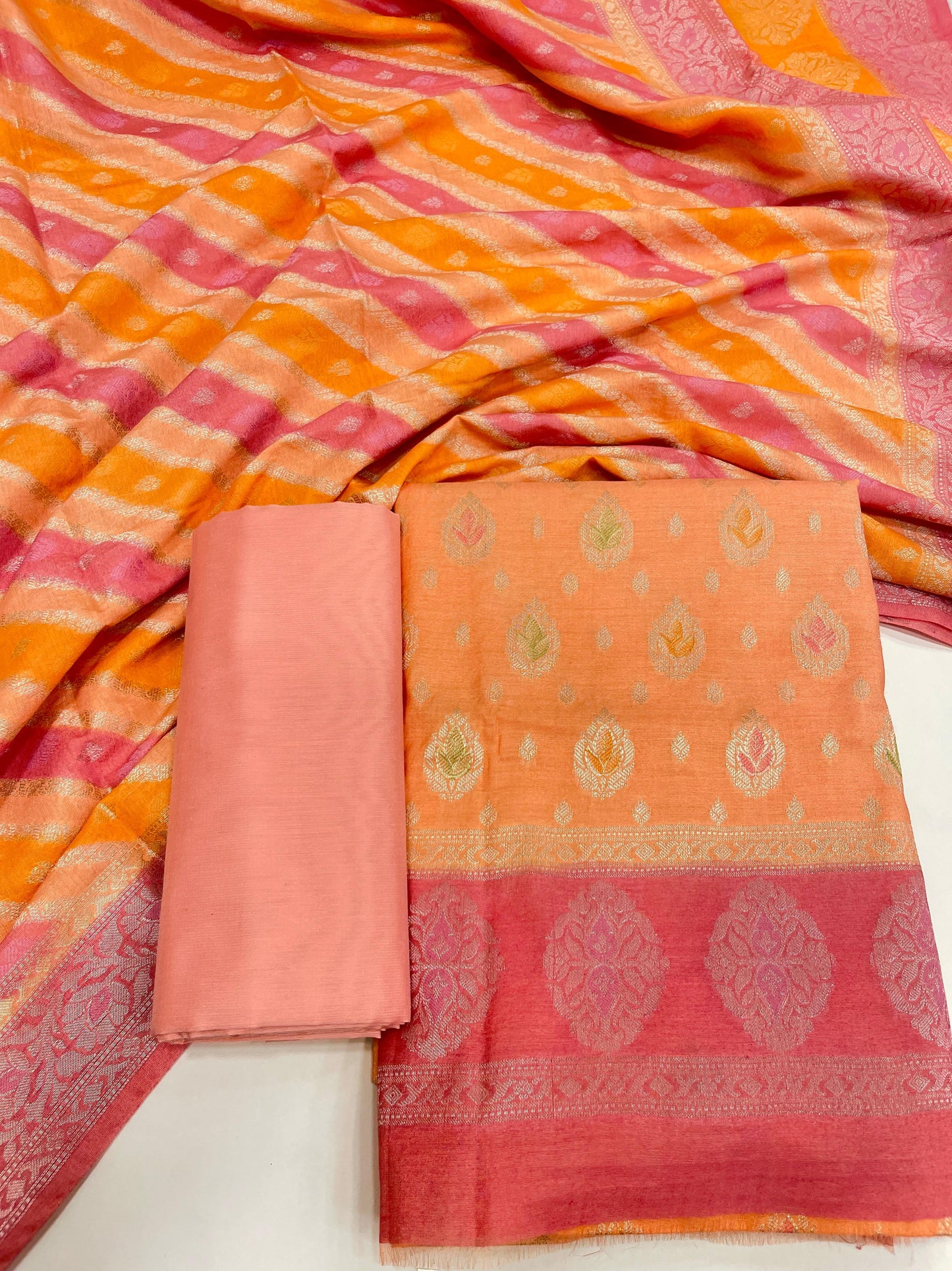 Faishana Presents Orange Alfi Mina Zari Booti and Contrast Pink Border 3pcs Suit with Rangkaat Multi Ada Stripe Dupatta and Plain Peach Bottom