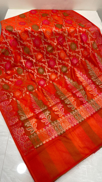 Faishana Presents Orange Semi Georgette Alfi Mina Floral Zari Jaal Minakari Zari Border with Banarasi Floral Boota Pallu and Red Multi Stripe Blouse
