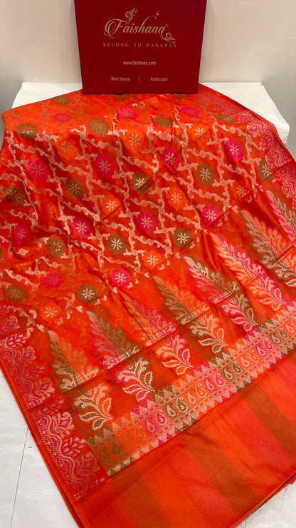 Faishana Presents Orange Semi Georgette Alfi Mina Floral Zari Jaal Minakari Zari Border with Banarasi Floral Boota Pallu and Red Multi Stripe Blouse