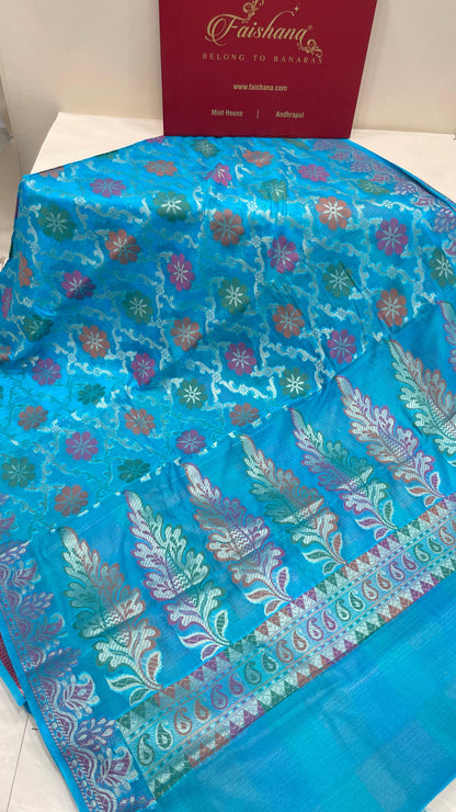 Faishana Presents Sky Blue Semi Georgette Alfi Mina Floral Zari Jaal Minakari Zari Border with Banarasi Floral Boota Pallu and Blue Multi Stripe Blouse