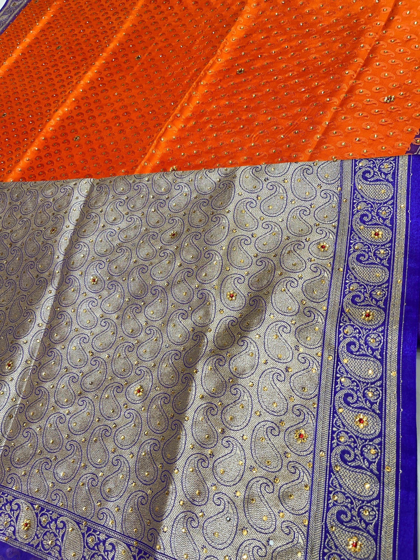 Faishana Presents Orange Tanchoi Silk Low Stone Work with Contrast Blue Pallu Zari Border and Purple Blouse