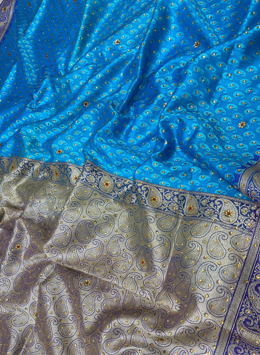 Faishana Presents Blue Tanchoi Silk Low Stone Work with Contrast Purple Pallu Zari Border Saree and Blue Blouse
