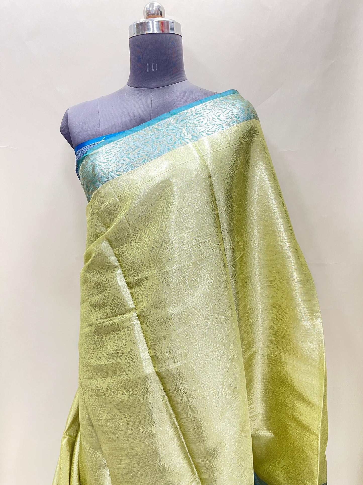 Faishana Presents LimeGreen Art Silk Floral Lehariya Sliver Jaal with Contrast Blue Pallu and Olive Copper Silver Jaal Zari Border with Blue Blouse