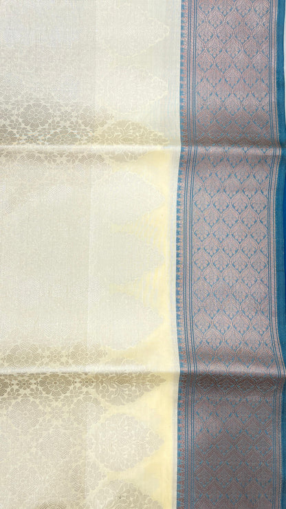 Faishana Presents Off-white Floral Mina Zari Stripe and Dual Skirt Copper and Silver Boota with Contrast Blue Pallu Blue Zari Border and Blue Blouse