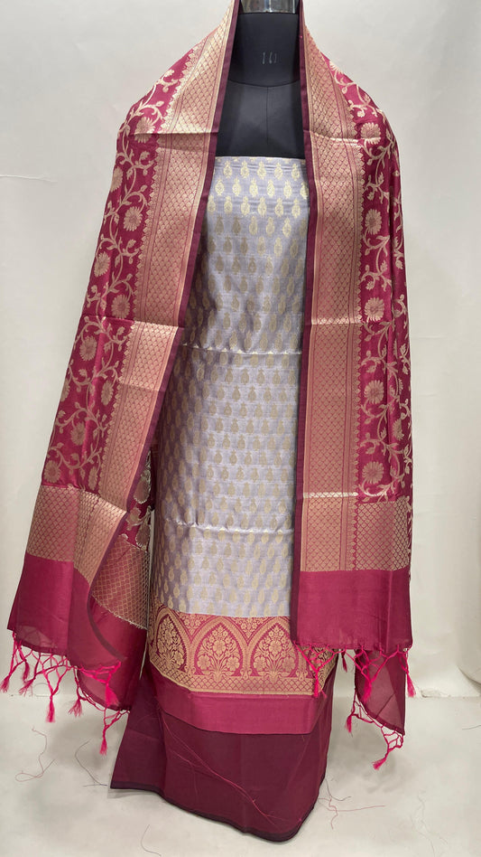 Faishana Presents Grey Semi Katan Silk 3 pcs Suit Set with Contrast Magenta Plain Bottom and Top Floral Zari Booti with Alfi Jaal Magenta Dupatta ASD_114
