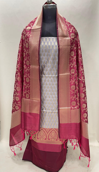 Faishana Presents Grey Semi Katan Silk 3 pcs Suit Set with Contrast Magenta Plain Bottom and Top Floral Zari Booti with Alfi Jaal Magenta Dupatta ASD_114