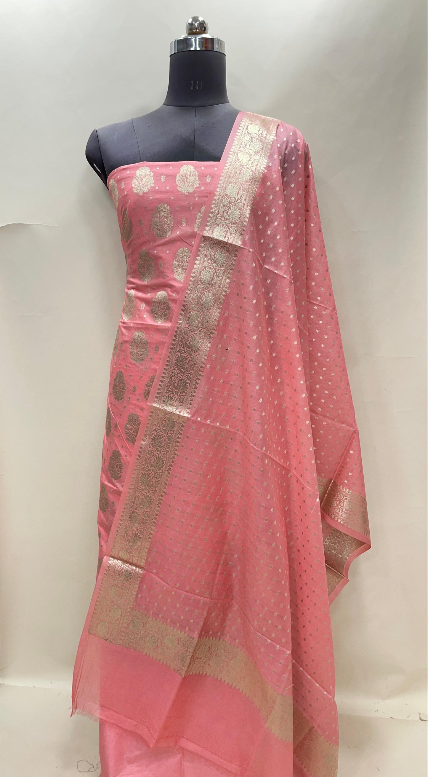Peach semi-georgette suit set featuring floral silver zari bootis and matching dupatta. SHL_39