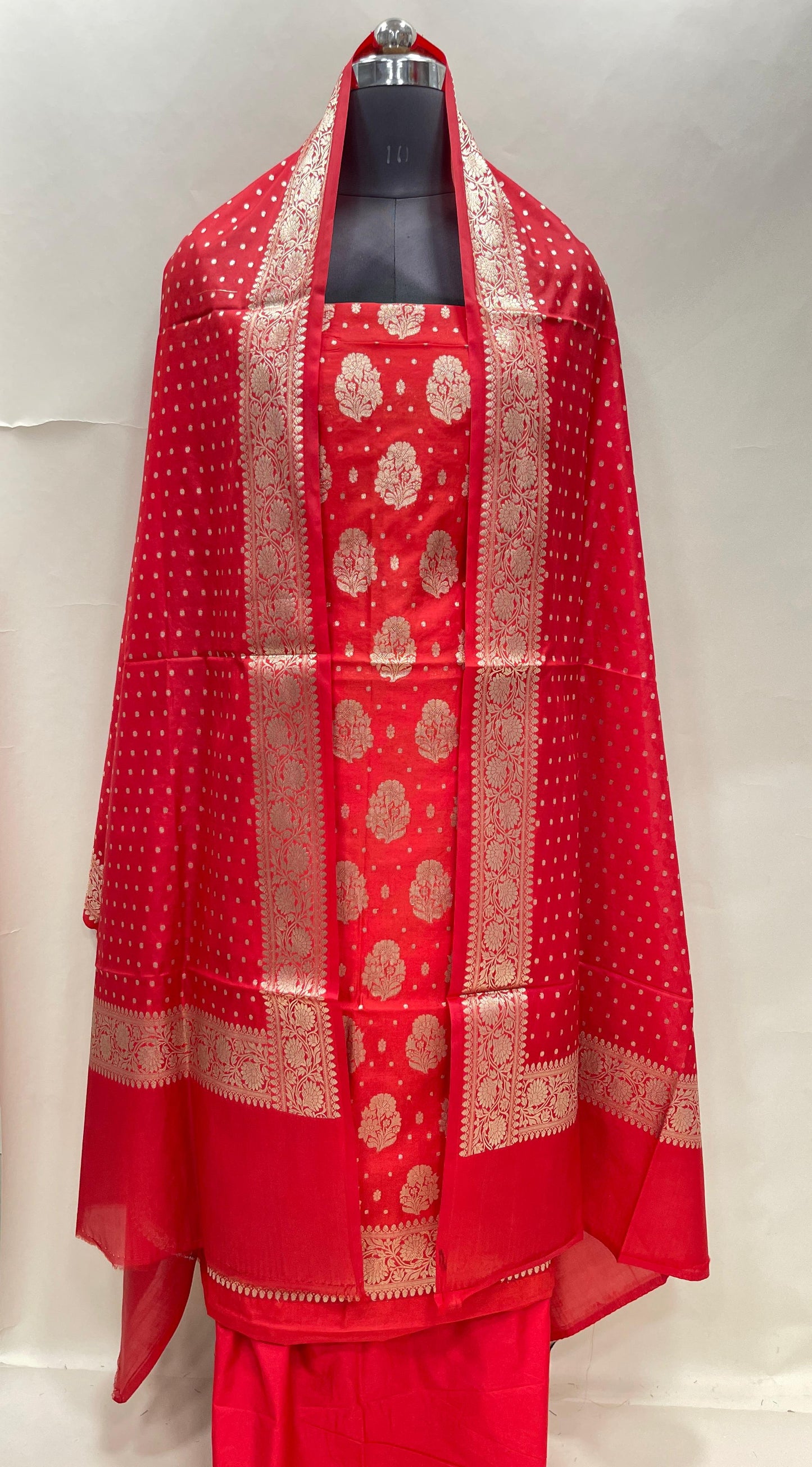 Red semi-georgette suit set featuring floral silver zari bootis and matching dupatta. SHL_43