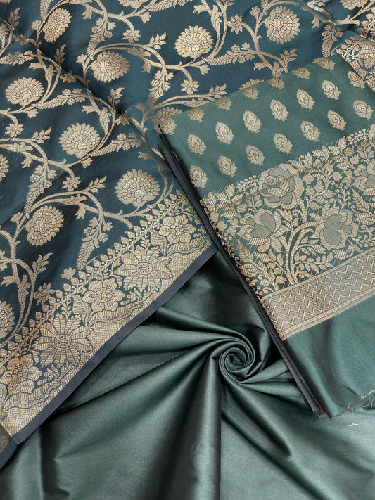 Dark green art silk suit set featuring floral zari bootis and matching dupatta. SHL_60