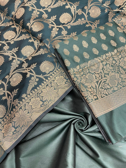 Dark green art silk suit set featuring floral zari bootis and matching dupatta. SHL_60