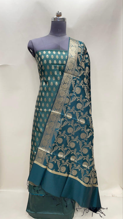 Dark green art silk suit set featuring floral zari bootis and matching dupatta. SHL_60
