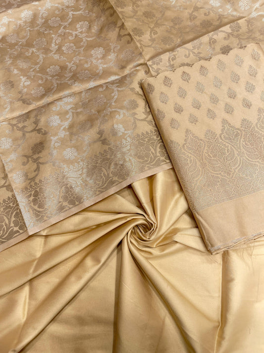 Cream art silk suit set featuring floral zari bootis and matching dupatta. SHL_62