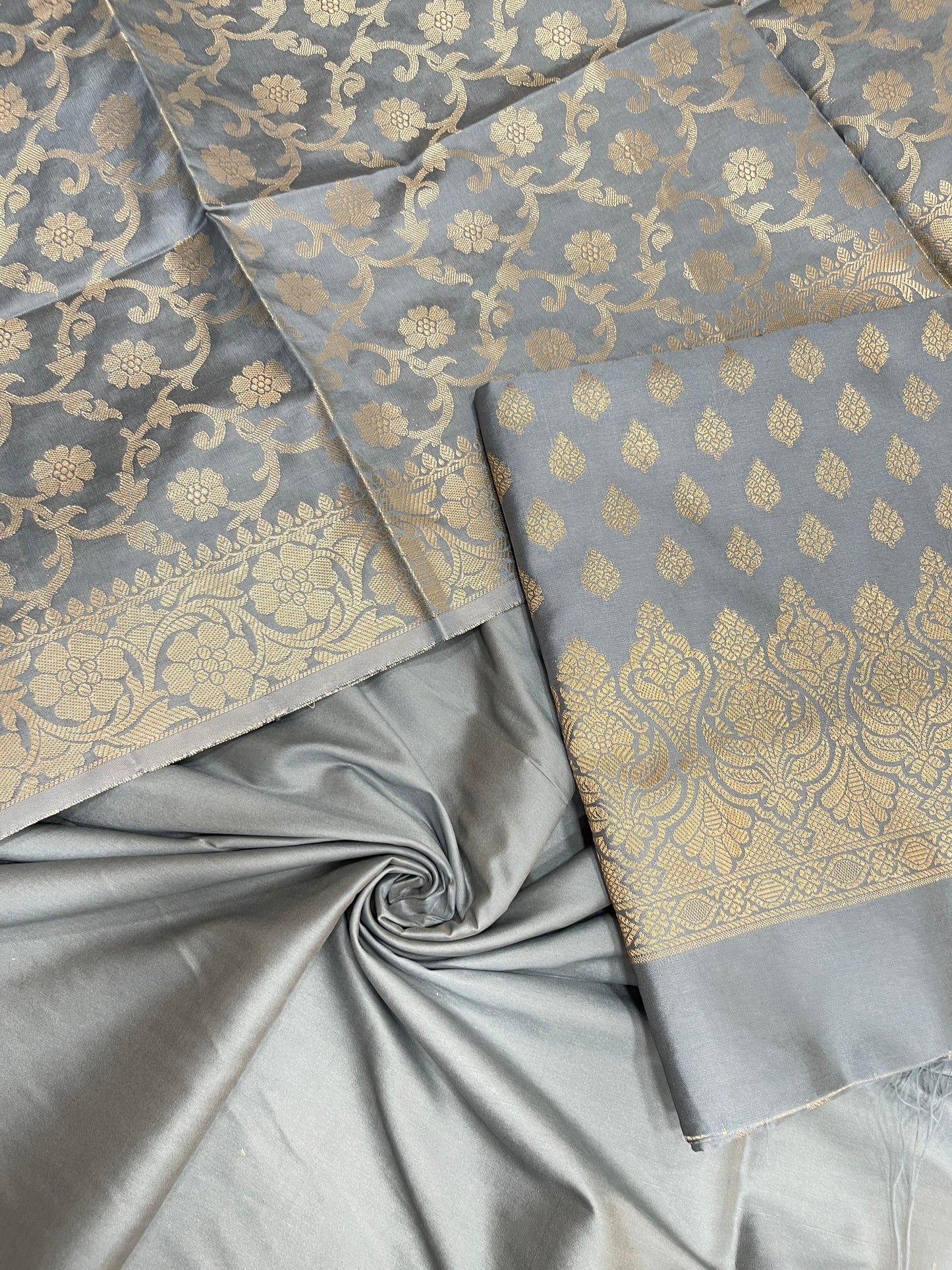 Grey art silk suit set featuring floral zari bootis and matching dupatta. SHL_66