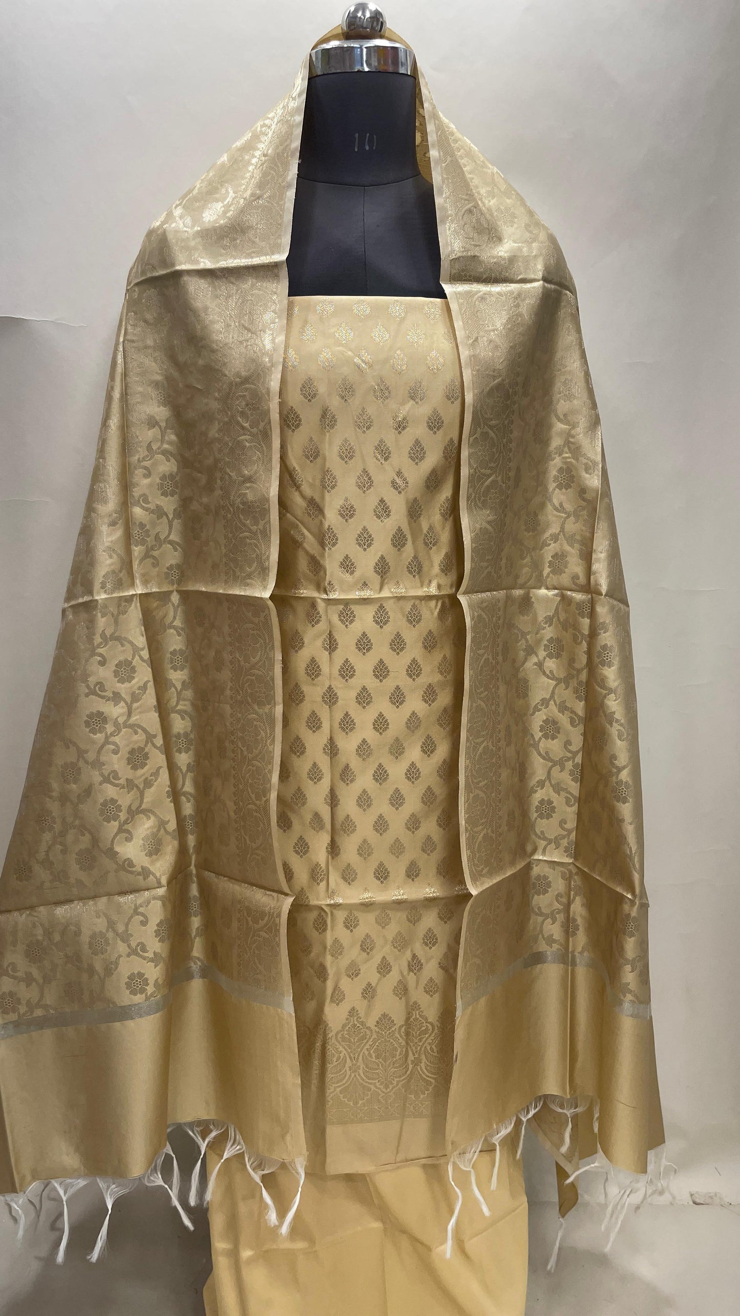 Cream art silk suit set featuring floral zari bootis and matching dupatta. SHL_62