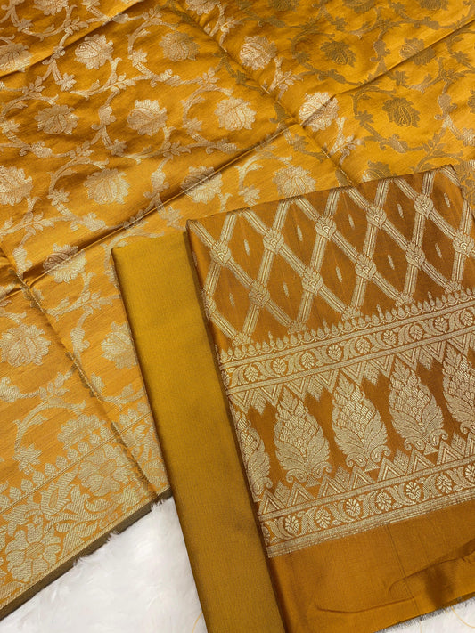 Mustard gold art silk suit set with diagonal zari stripes and matching dupatta. SHL_54
