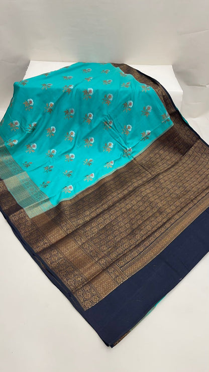 Faishana Pure Silk Handloom Sea Green Muga Silk Zari Mina Floral Booti Contrast Navy Blue Anchal Copper Zari Border Banarasi Saree with Navy Blouse